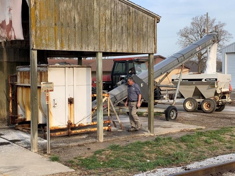 Todd is mixing and loading another batch of fertilizer.